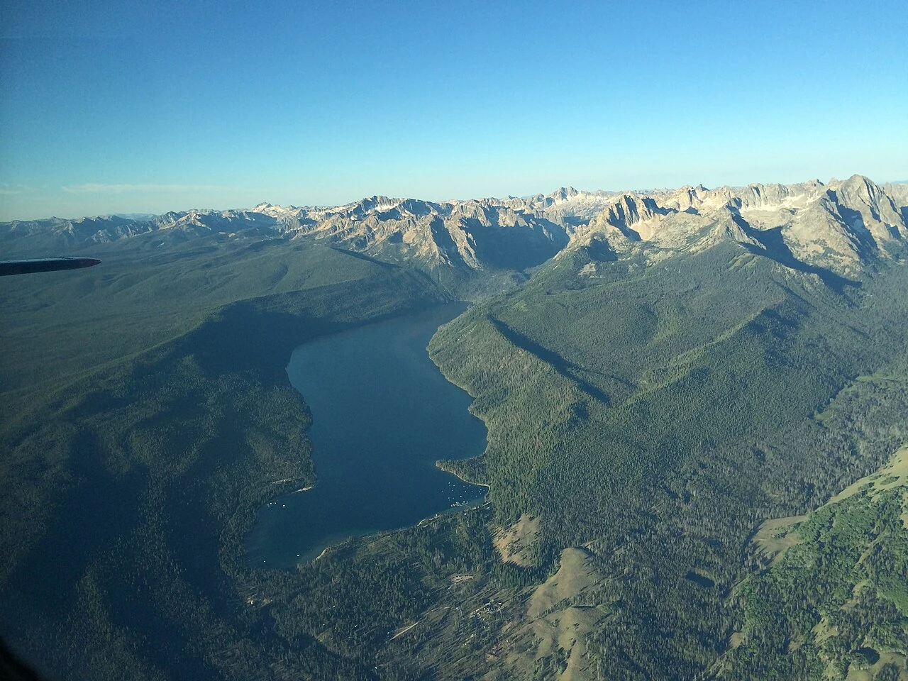The blue water of Redfish Lake surrounded by Idaho mountains